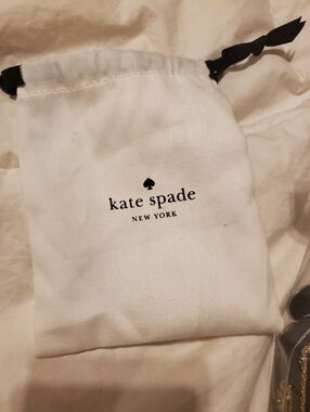 kate spade White Drawstring Logo Pouch with Black Ribbon